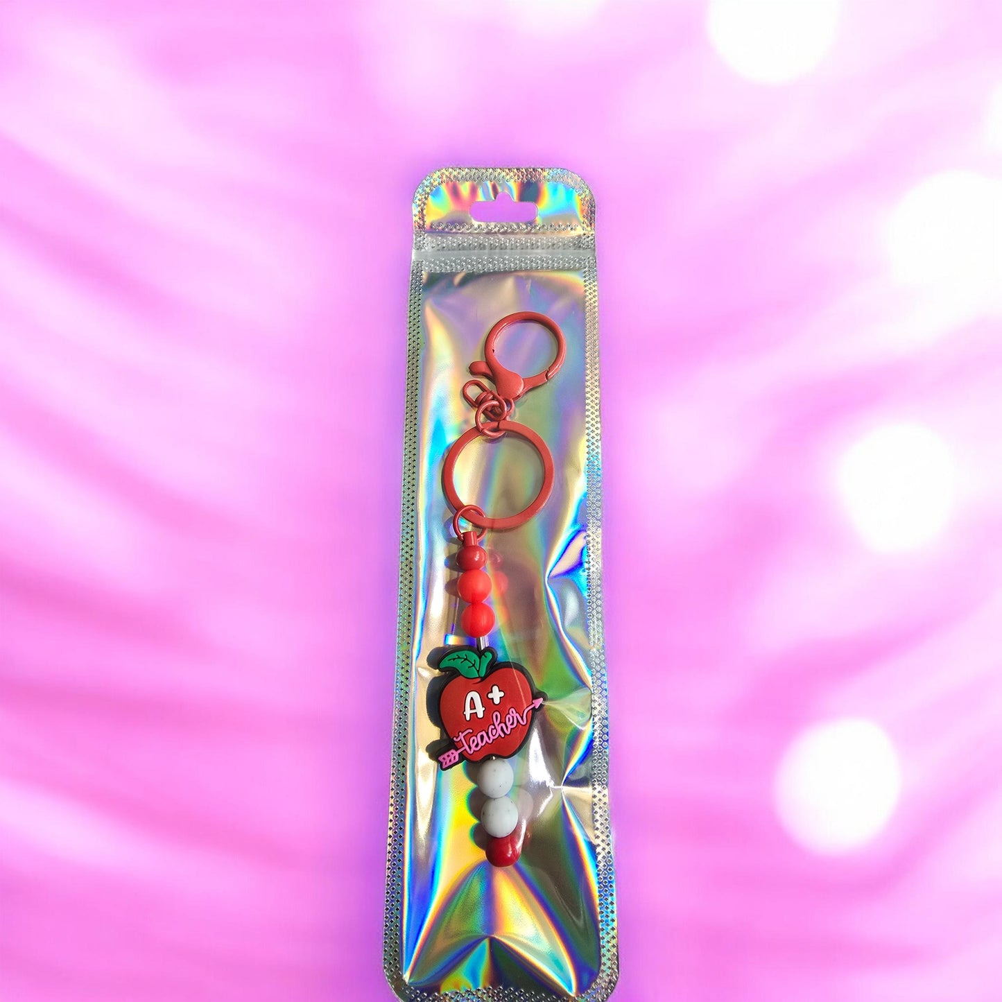 red teacher keyring