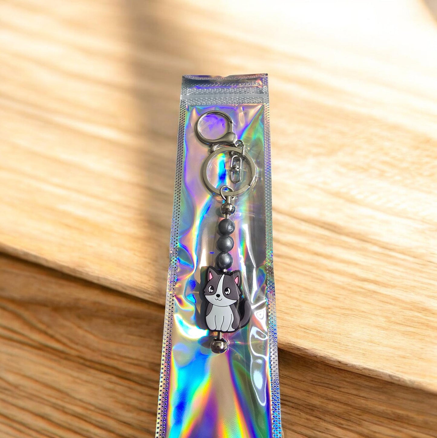 grey and white cat keyring