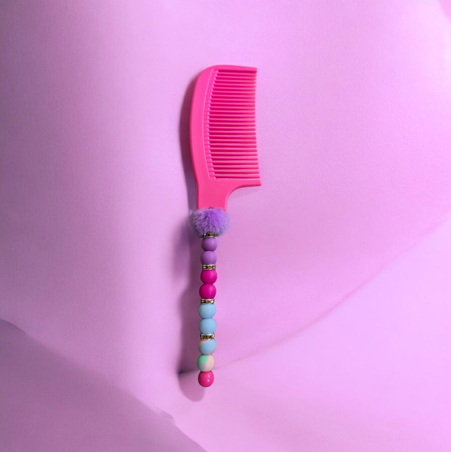 pink beaded comb