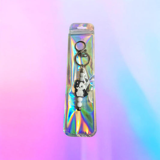 white and black cat keyrings