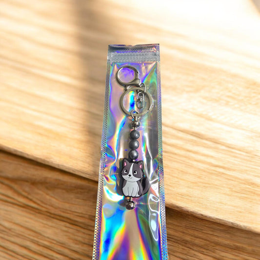 grey and white cat keyring