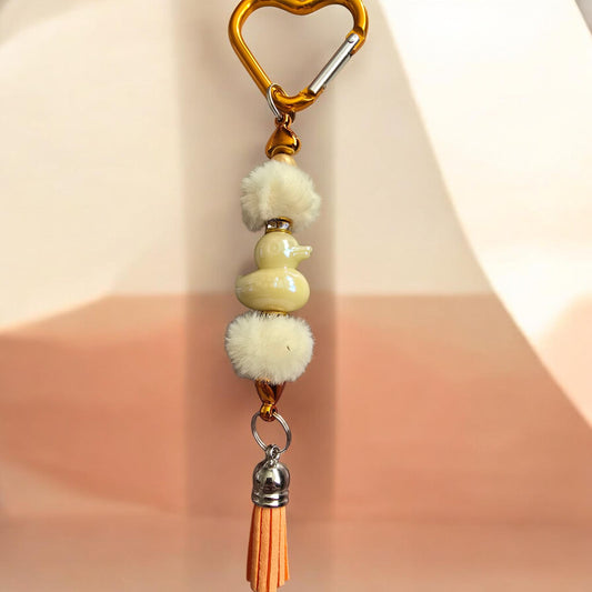 orange bag charm with yellow duck